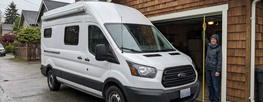 Tall cargo van entering a residential garage safely