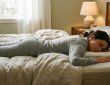 Low-profile slim pillow on a minimalist bed setup.